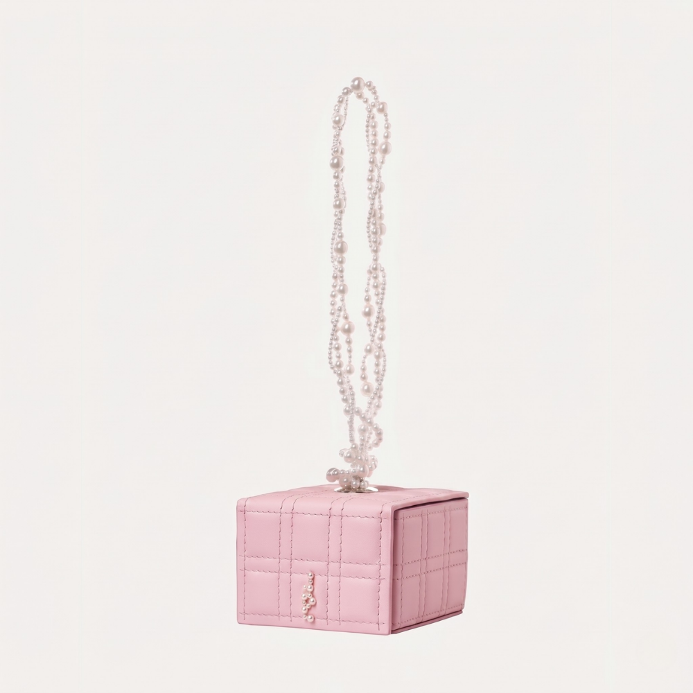 Leather handbag with pearl handle and silver hardware, perfect for occasions. Shop online from our curated edit of premium fashion.