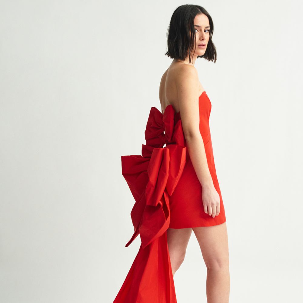 Shop the Cuquismo Dress in red taffeta with handmade bows and train in the back. Perfect for evening and party wear. Shop now!