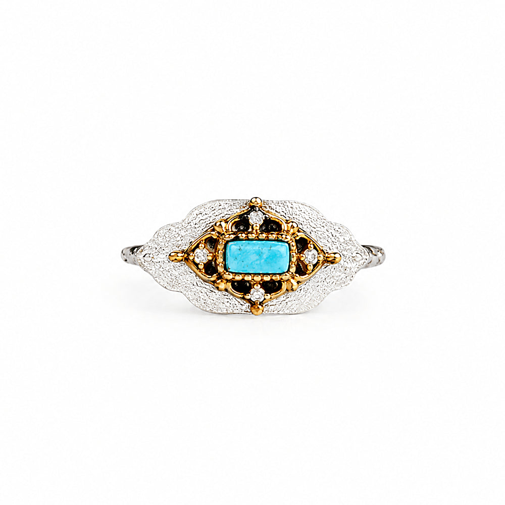 Discover the Dakini Turquoise & Sterling Silver Ring at The Luxe Maison, featuring a vivid natural turquoise centerpiece framed by textured sterling silver and warm 14K gold vermeil accents. Inspired by the Himalayan sky dancer, this distinctive ring blends nature-inspired detailing with timeless elegance and a touch of bohemian charm.