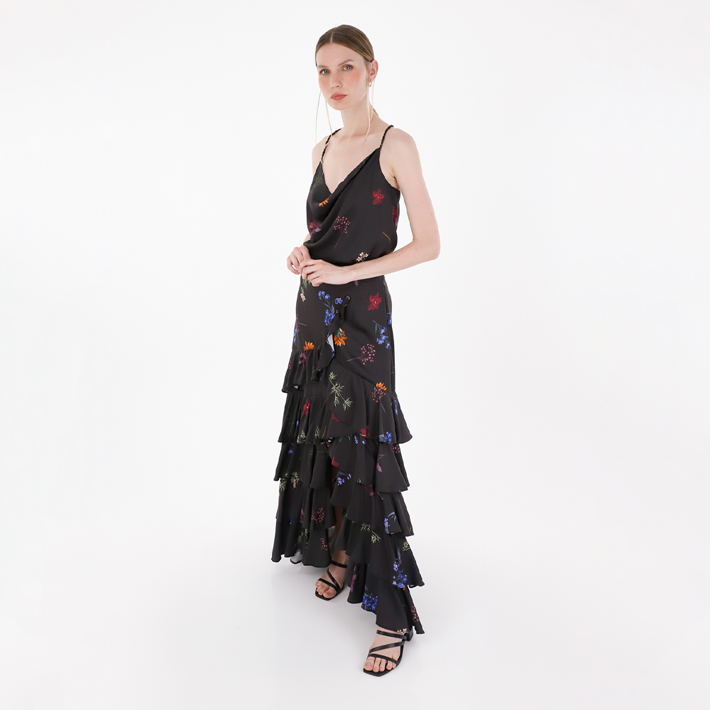 This long skirt features a high waist that accentuates your silhouette and tiered ruffles.