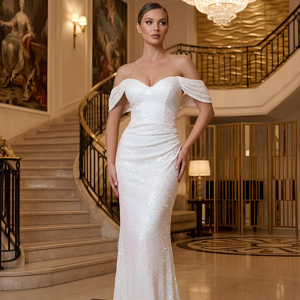 Shop online from our exclusive website. Discover the Dayna white sequin floor-length gown featuring a figure-flattering silhouette and dazzling elegance for weddings, galas, evening parties, and special occasions.