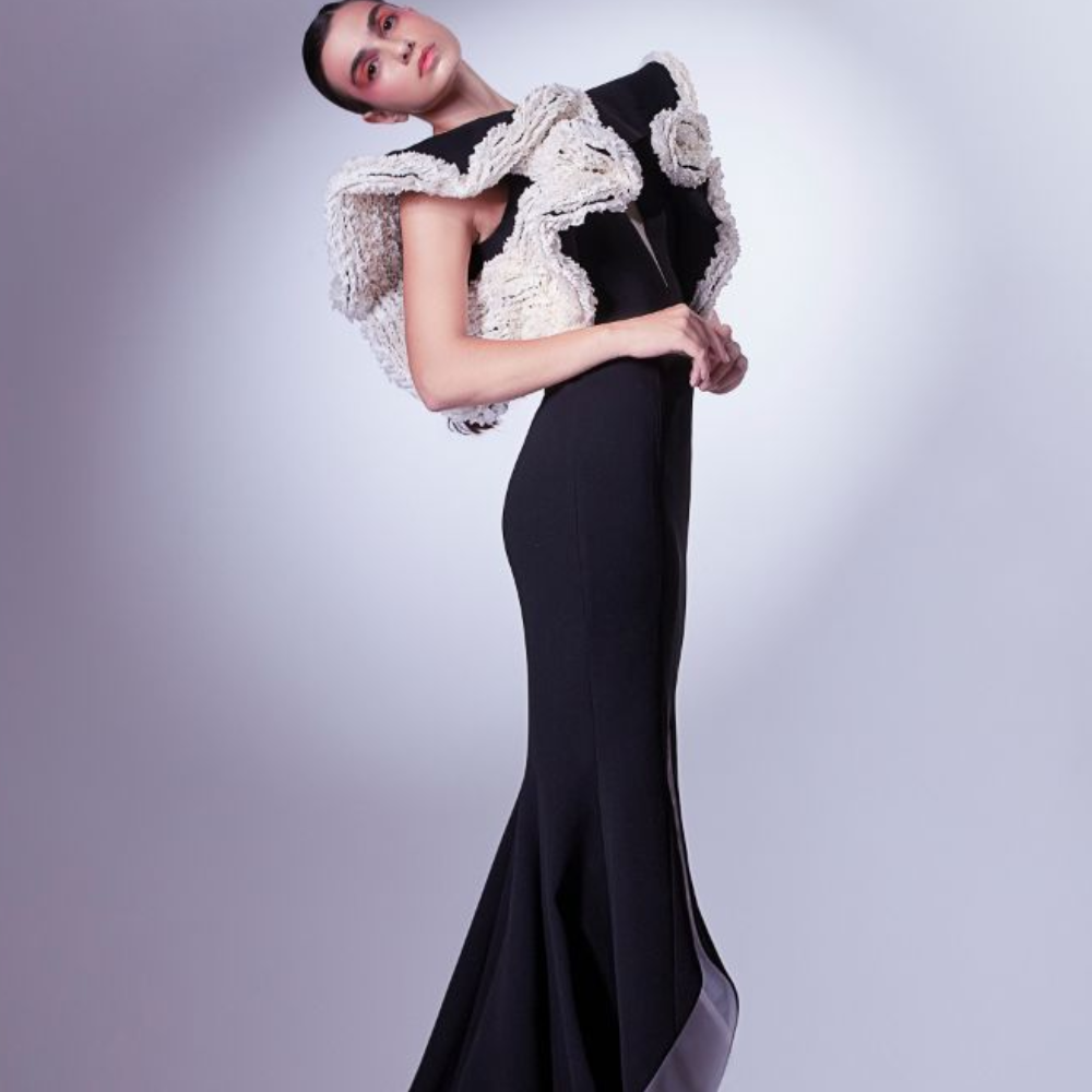 This dramatic deep V dress is crafted in a mermaid silhouette and rendered in black and white.