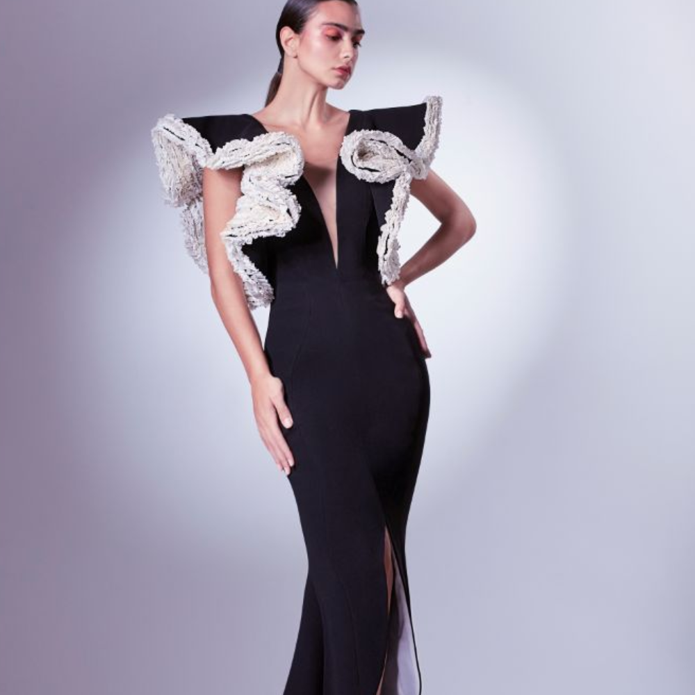 This dramatic deep V dress is crafted in a mermaid silhouette and rendered in black and white.