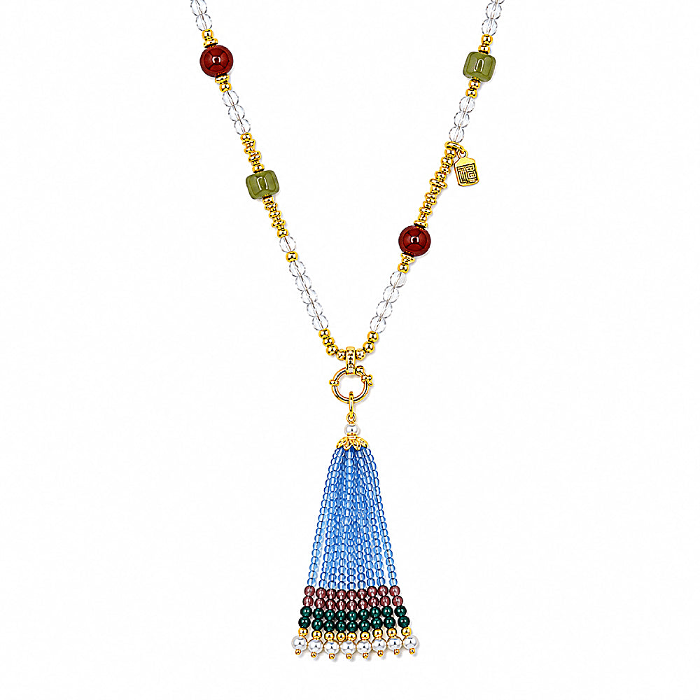 Discover the Devi Clear Quartz Convertible Tassel Necklace at The Luxe Maison, featuring clear quartz, carnelian, jade, and a removable spinel bead tassel for a vibrant, versatile look with elegant gold-plated accents.