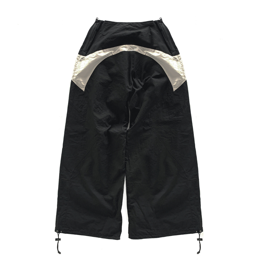 Shop online from our exclusive website and discover the Dimension Track Pants by Voitech®, featuring technical nylon, reflective panels, adjustable bungee hems, and a modular futuristic streetwear design.