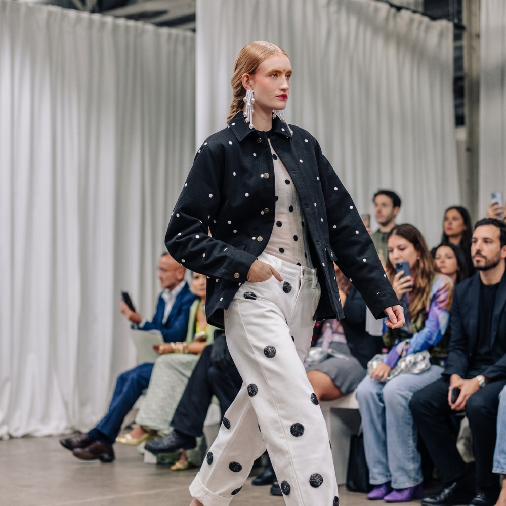 Recycled denim jacket with handmade 3D polka dot embroidery. Bold, playful, and durable. Shop premium styles online.