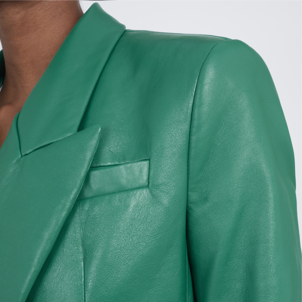 Elegant, cool and smart, this double-breasted blazer is crafted in leather with padded shoulders and peak lapels. 