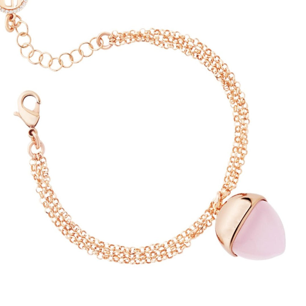 Elegant rose gold plated double strand bracelet with a rose quartz-colored pyramid crystal pendant and sparkling accents. Shop premium jewelry online.