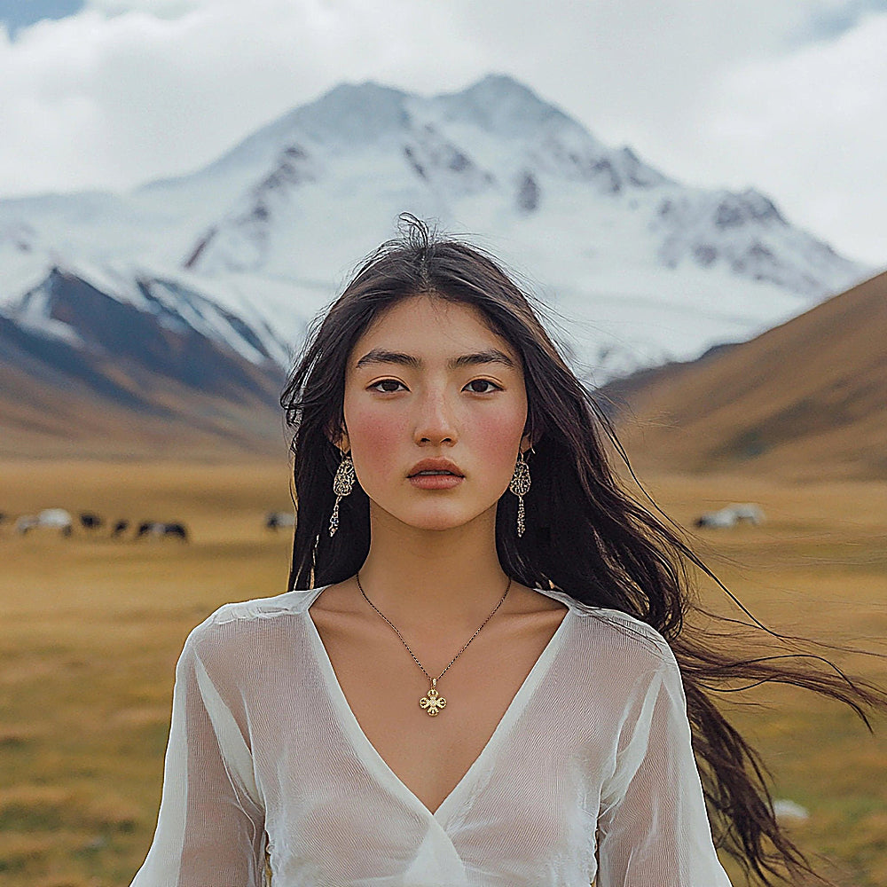 Discover the Double Vajra Gold Vermeil Pendant Necklace at The Luxe Maison, featuring an 18K gold vermeil pendant, sparkling cubic zirconia accents, and an adjustable black and gold chain for a spiritual, elegant look.