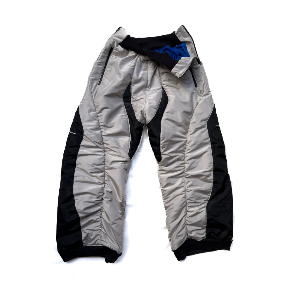 Shop online from our exclusive website and discover the Downforce Bomber Track Pants by Voitech®, crafted from a high-density technical shell with an insulated design for futuristic performance streetwear.