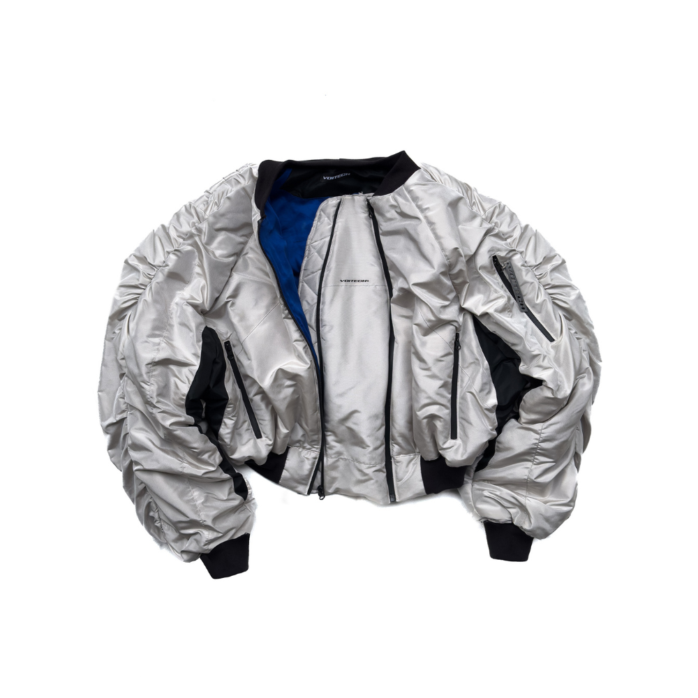 Shop online from our exclusive website. Explore the VOITECH® Downforce Twin Zip Bomber Jacket with an insulated technical shell, signature twin-zip closure, oversized aerodynamic fit, and sculpted performance-inspired design.