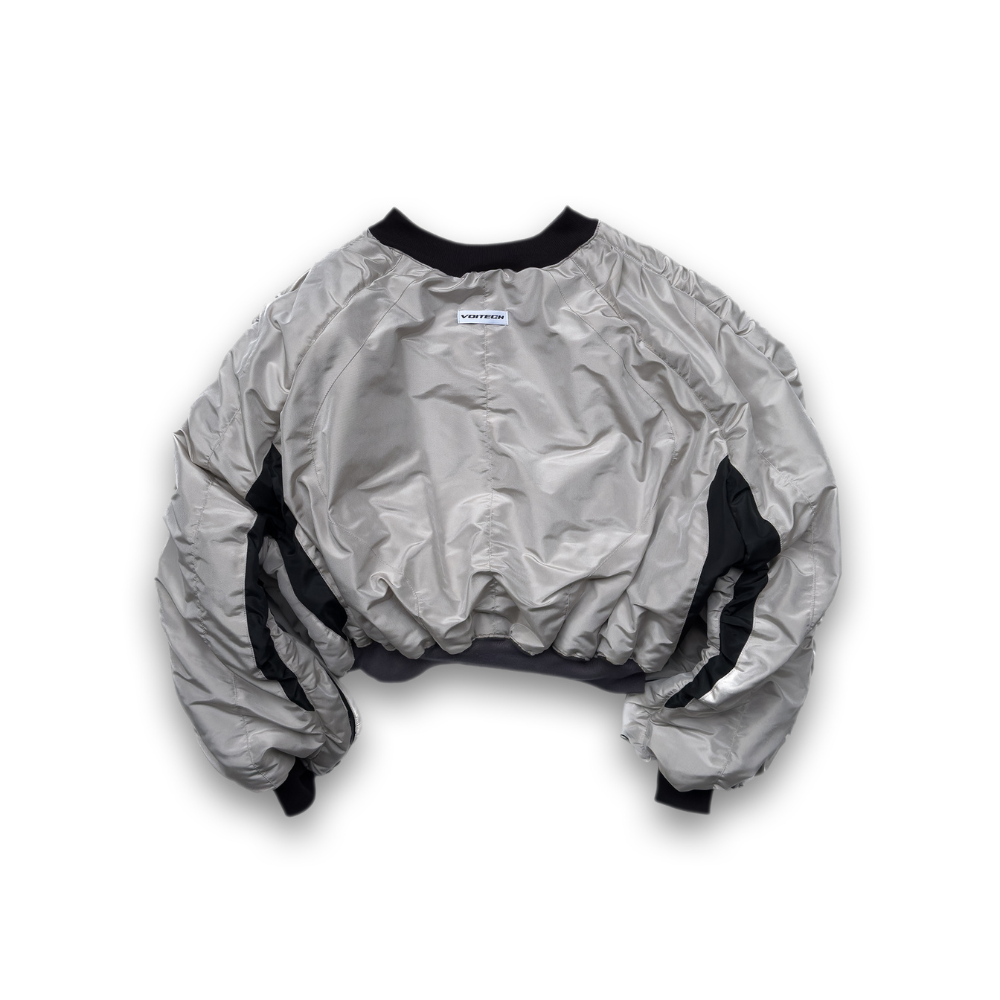 Shop online from our exclusive website. Explore the VOITECH® Downforce Twin Zip Bomber Jacket with an insulated technical shell, signature twin-zip closure, oversized aerodynamic fit, and sculpted performance-inspired design.