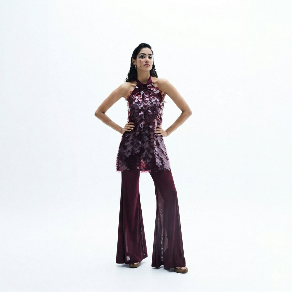 Sequin halter top with flared pants and water sequin detail, perfect for vacations. Shop online from our exclusive collection of premium styles.