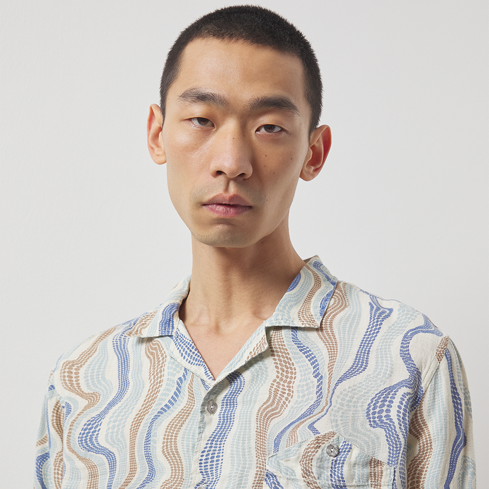 Lightweight sand, blue and butter cream printed 100% linen long-sleeve shirt with a boxy fit. 