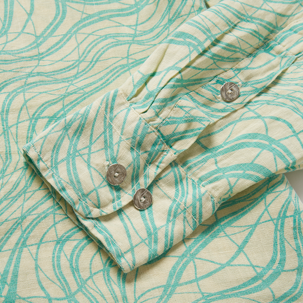 Lightweight seafoam green and off-white printed 100% linen long-sleeve shirt with a boxy fit. 