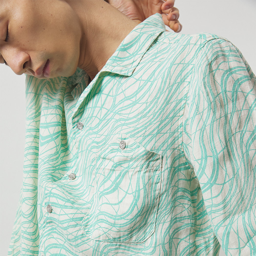 Lightweight seafoam green and off-white printed 100% linen long-sleeve shirt with a boxy fit. 