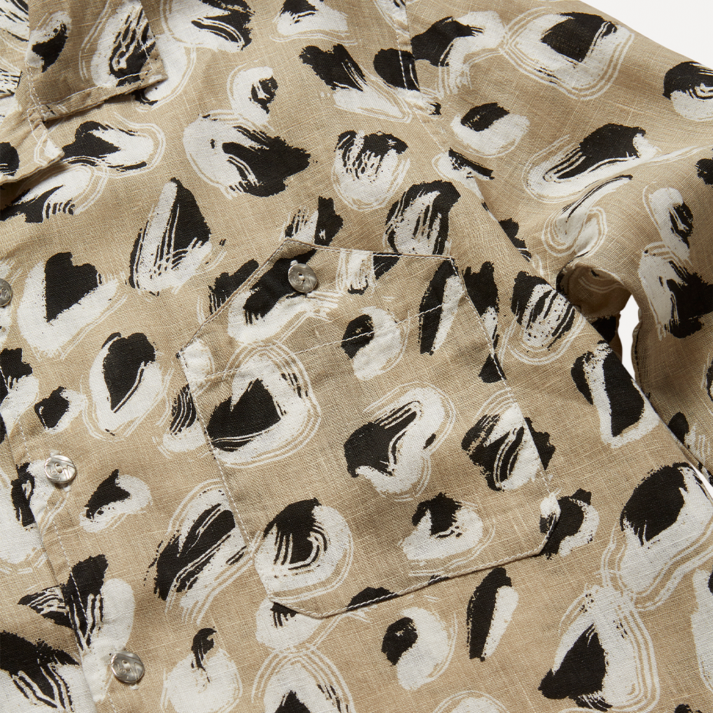 Lightweight hazelnut, black and off-white printed 100% linen long-sleeve shirt with a boxy fit. 
