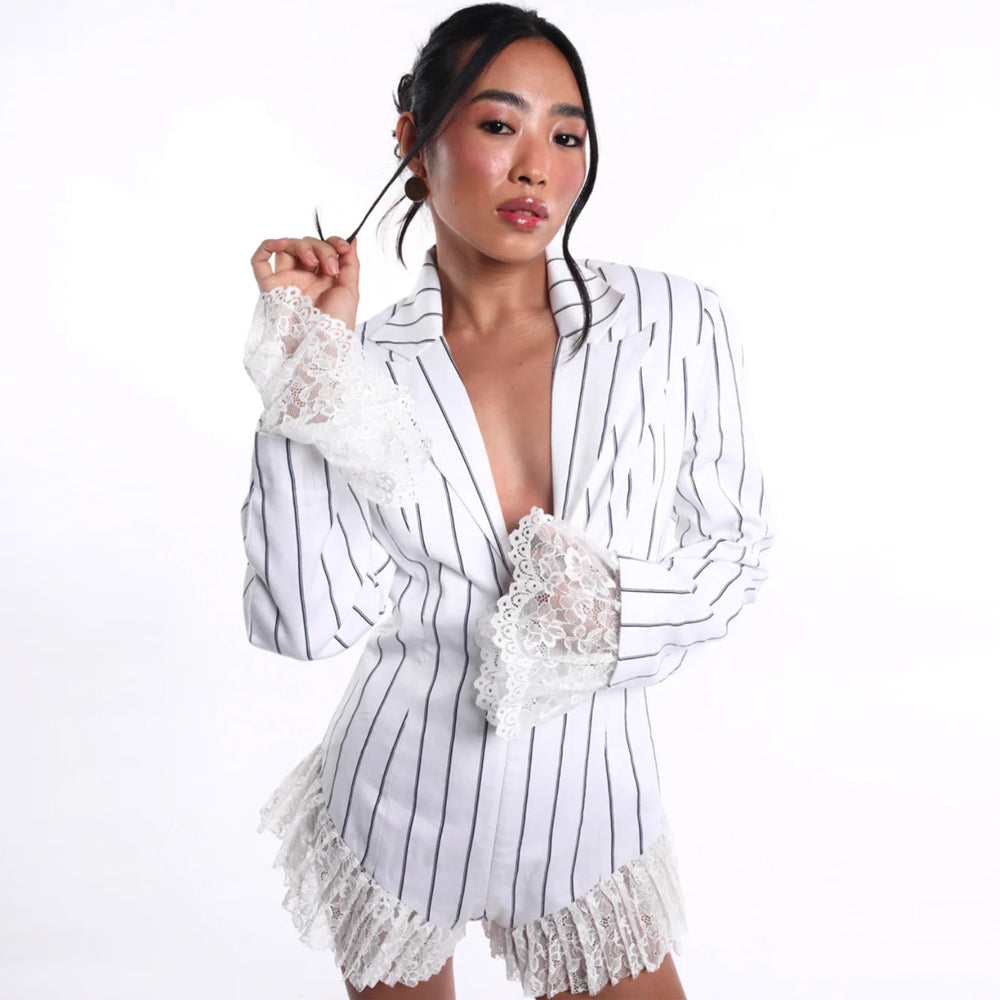 Pinstripe jumpsuit with plunge neckline and lace detail, perfect for events. Shop online from our curated edit of premium fashion.
