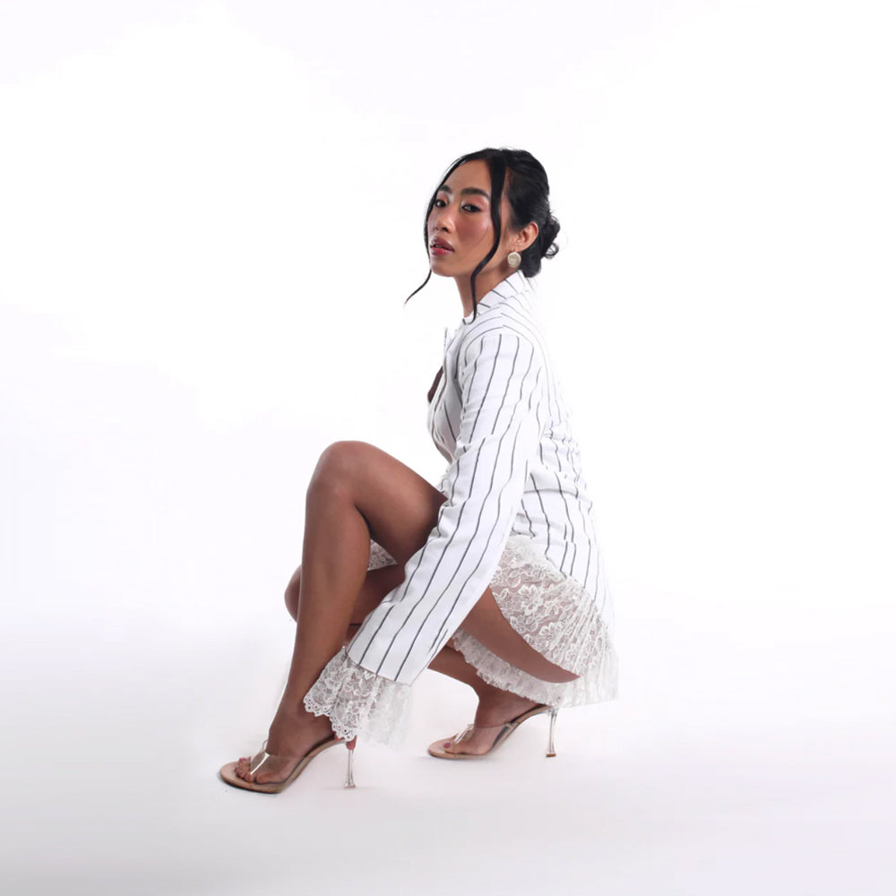Pinstripe jumpsuit with plunge neckline and lace detail, perfect for events. Shop online from our curated edit of premium fashion.