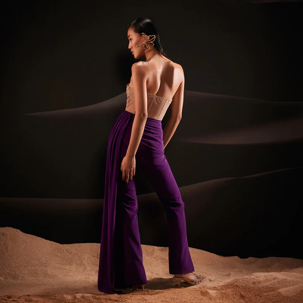 Designed using nude-colored sequins on delicate net and lush crepe fabric in purple hue.