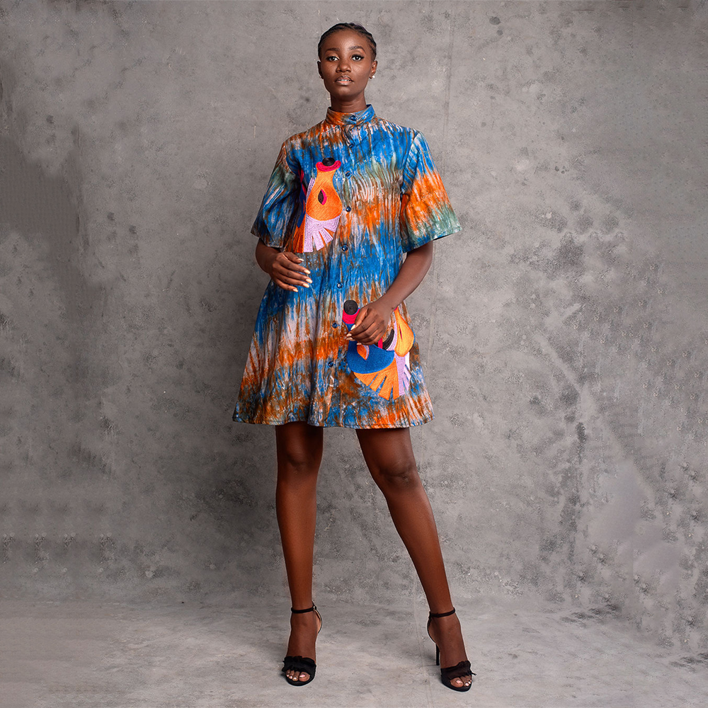 Trendy embroidered tie-dye mini dress: Fusion of vibrant hues and intricate patterns, a bohemian chic statement.