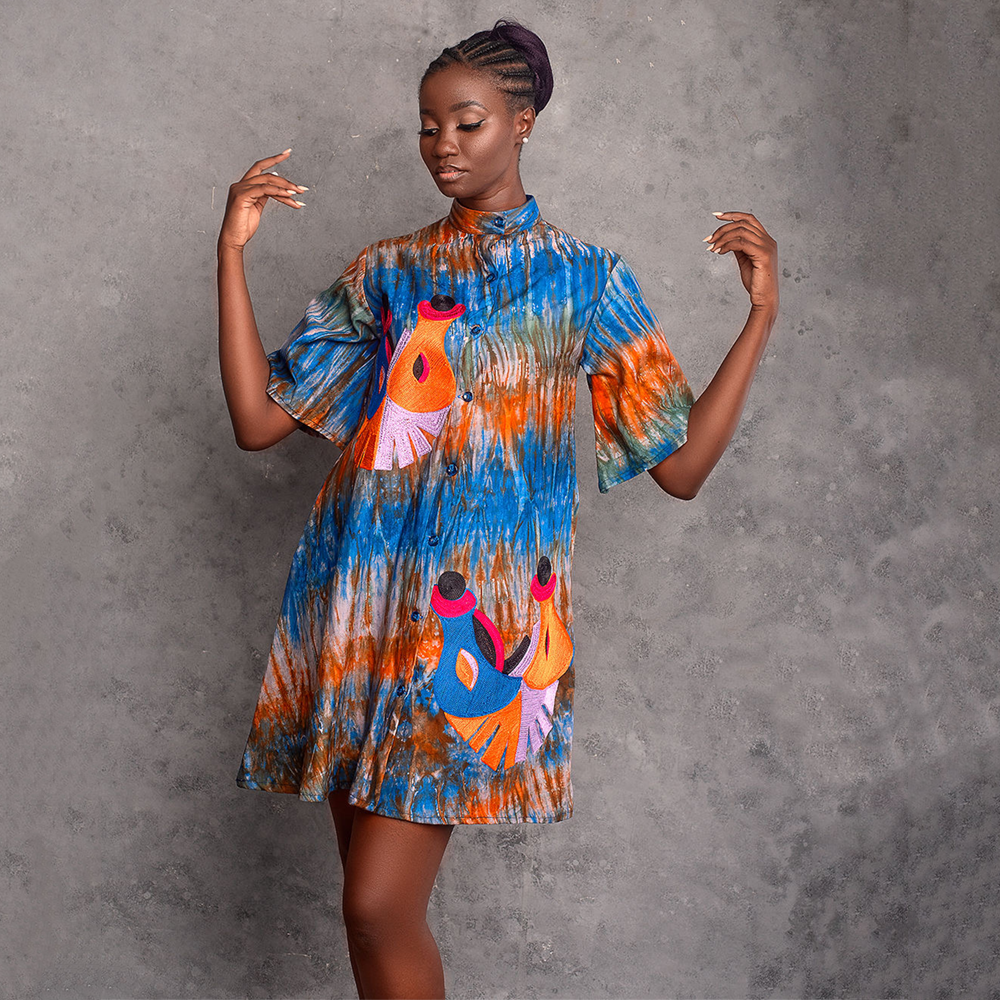 Trendy embroidered tie-dye mini dress: Fusion of vibrant hues and intricate patterns, a bohemian chic statement.