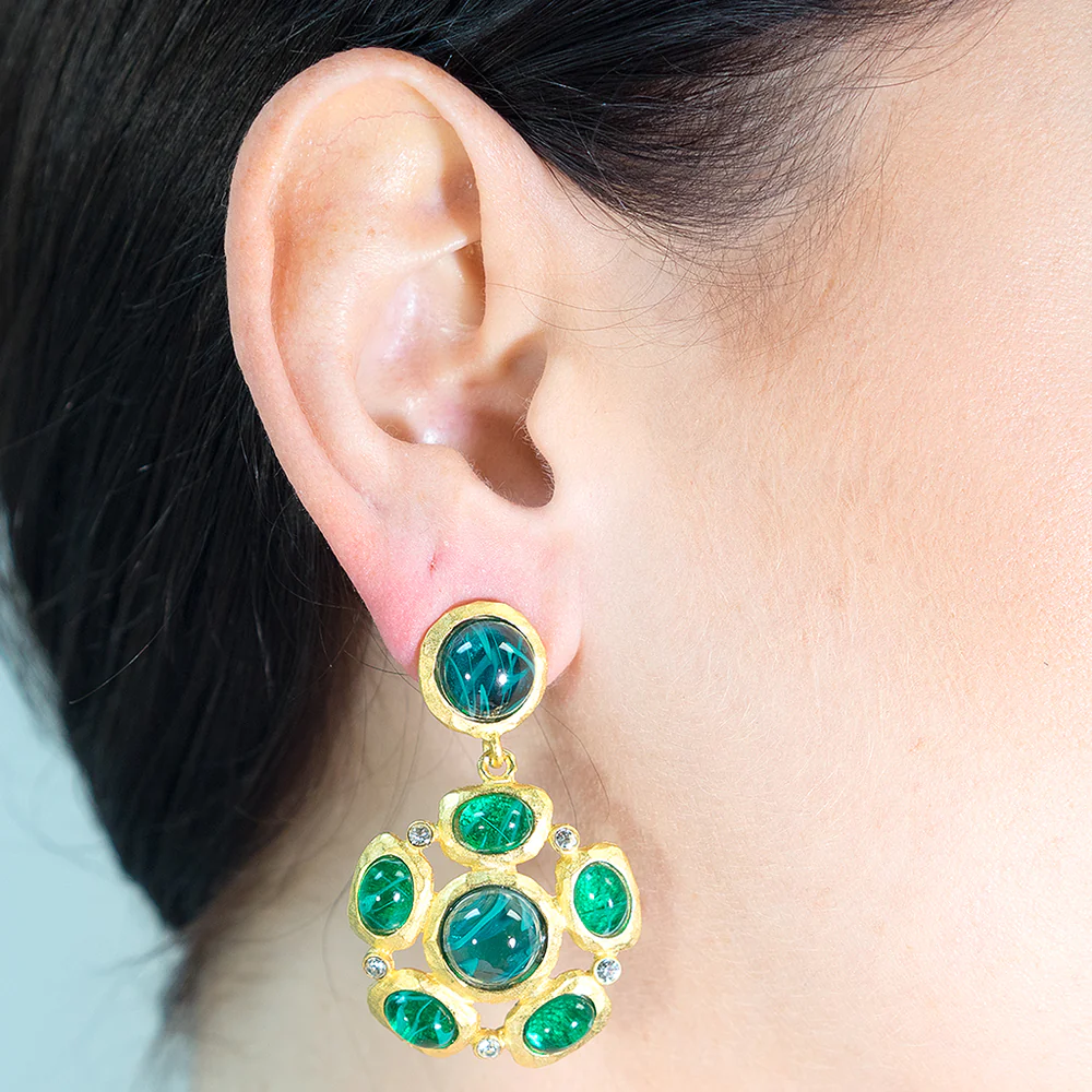 Hammered satin gold pierced earring with emerald cabochon clusters and clear crystal accents.