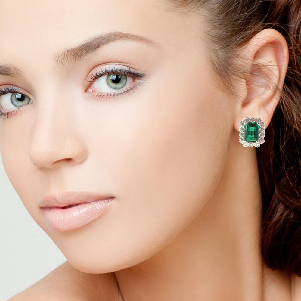 Shop online premium sterling silver emerald stud earrings with sparkling cubic zirconia stones.