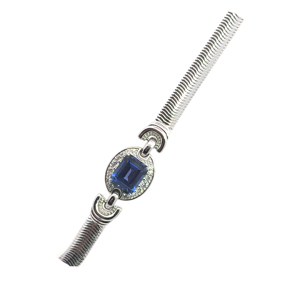 Sterling silver bracelet featuring a square emerald-cut lab-created blue sapphire center stone framed with sparkling cubic zirconia accents. Shop premium jewelry online.