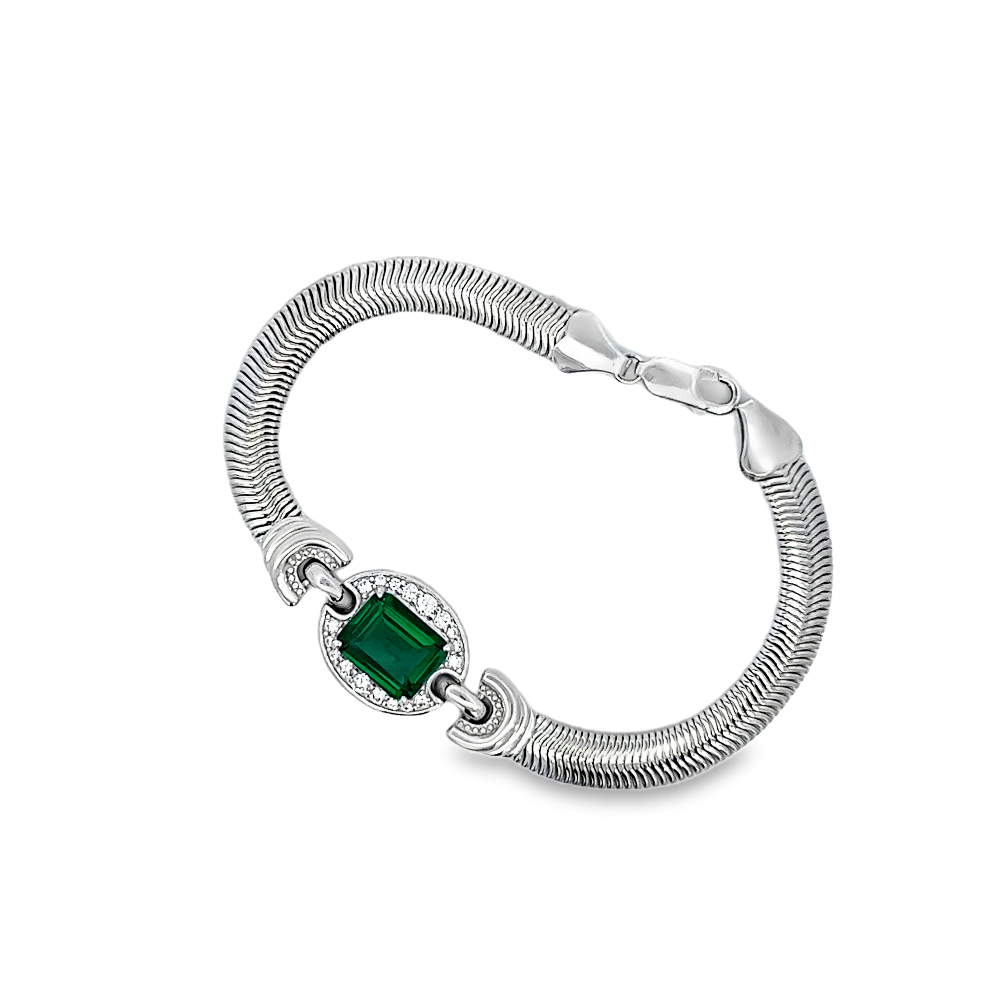 Sterling silver bracelet featuring a square lab-created emerald center stone framed with sparkling cubic zirconia accents for a bold modern look. Shop premium jewelry online.