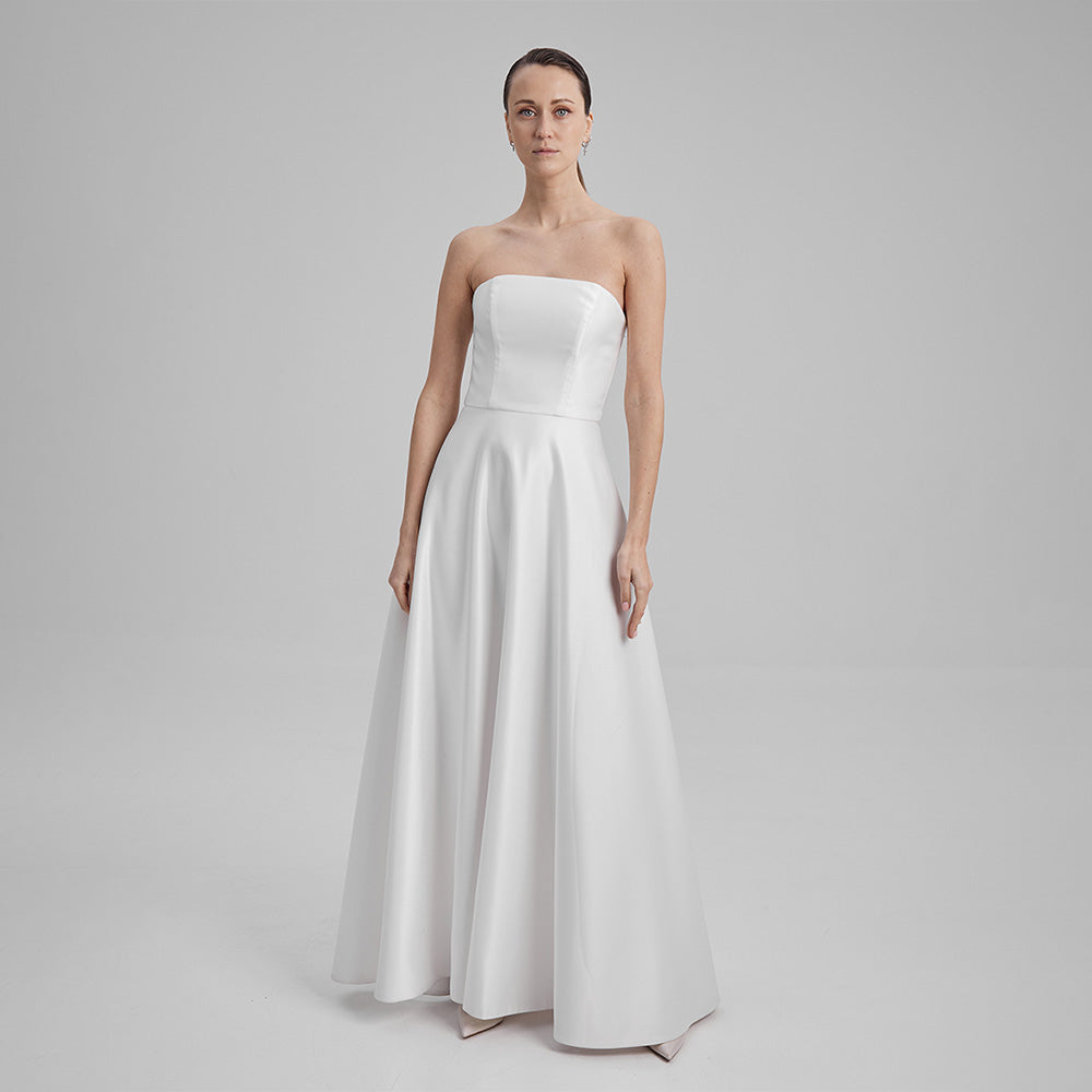 White Maxi Eve dress made from Mikado fabric and a corseted straight neckline exuding timeless elegance. Explore evening dresses for women. Shop now!