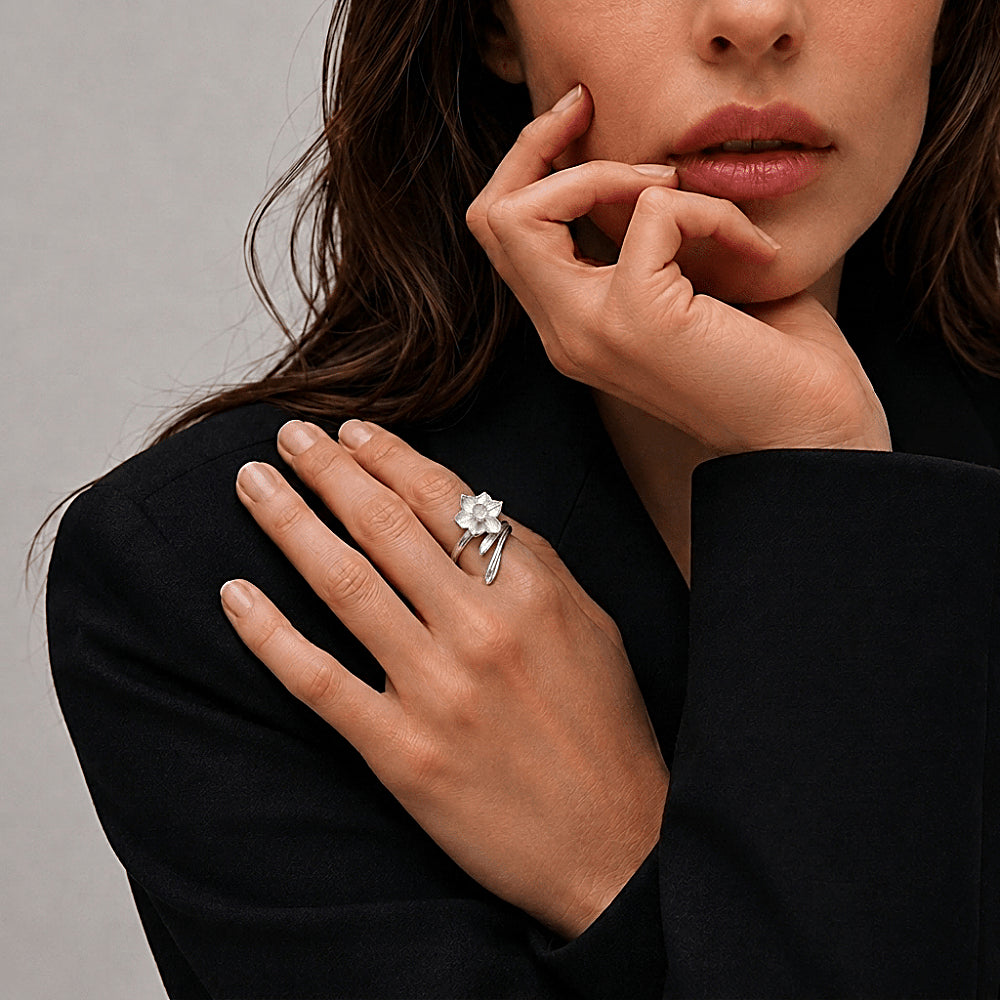 Discover the First Bloom Daffodil Sterling Silver Ring at The Luxe Maison, featuring a sculpted daffodil blossom with delicately textured petals and an adjustable sterling silver band. Inspired by springtime renewal and new beginnings, this nature-inspired ring adds a graceful floral touch to everyday style.