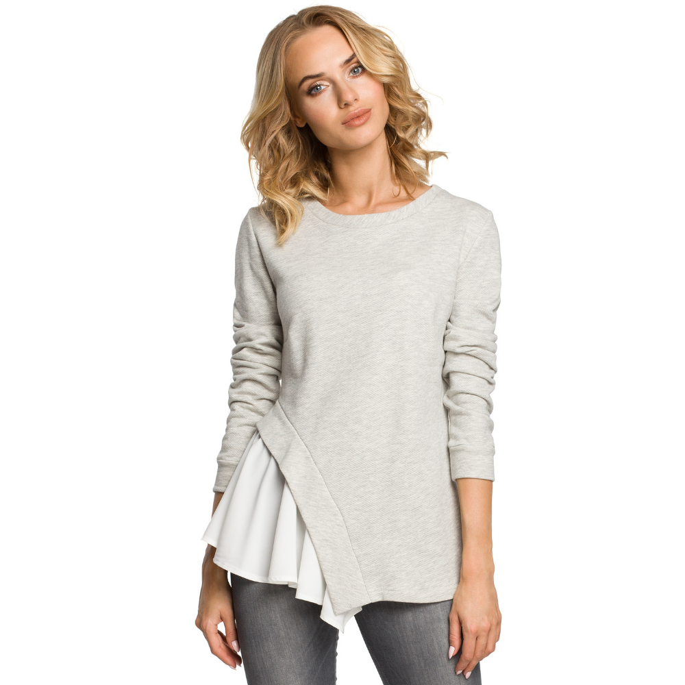 Fitted knit blouse with asymmetric cutout, draped woven side with 3/4 sleeves.