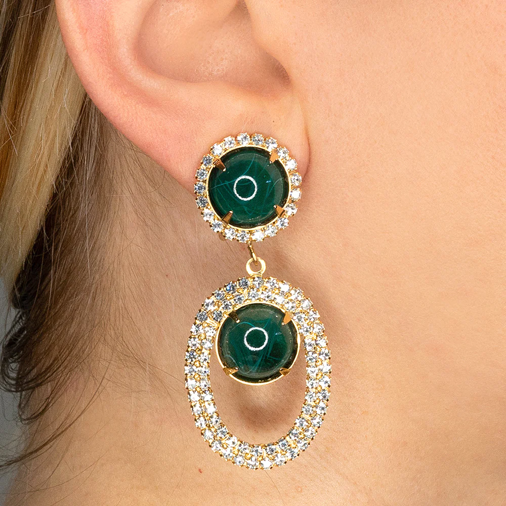 These flawed emerald teardrop earrings will make a statement as soon as you walk into a room.