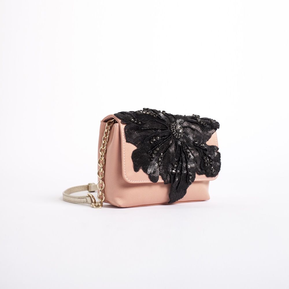 Beautifully crafted, this evening essential features intricate bow embellishments at the front. 