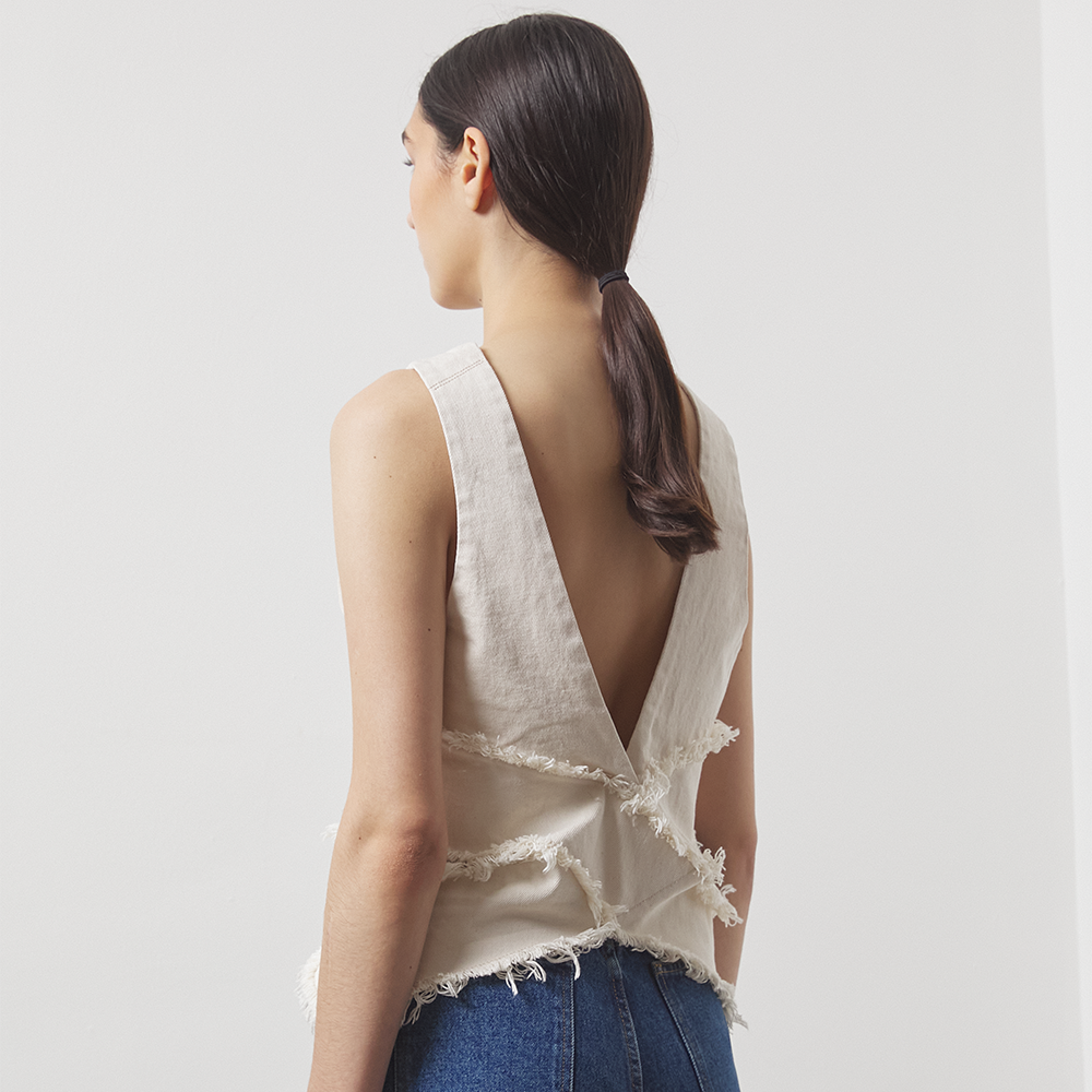 Cut-out vest in natural off-white mid-weight 100% cotton organic denim. Cropped length and cut for a slightly loose fit. 