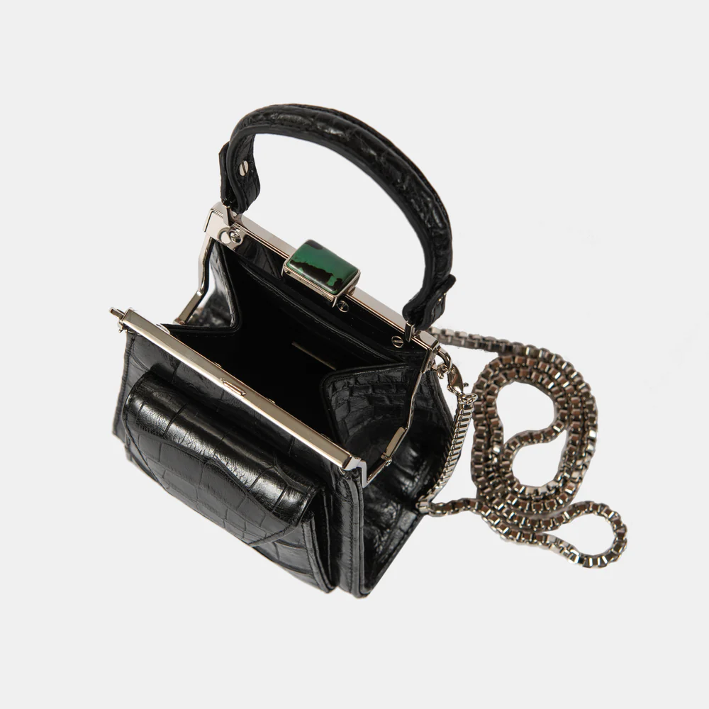 This playful mini bag fuses classic craftsmanship with creative kitsch. Quirky, classy and quintessentially cool.