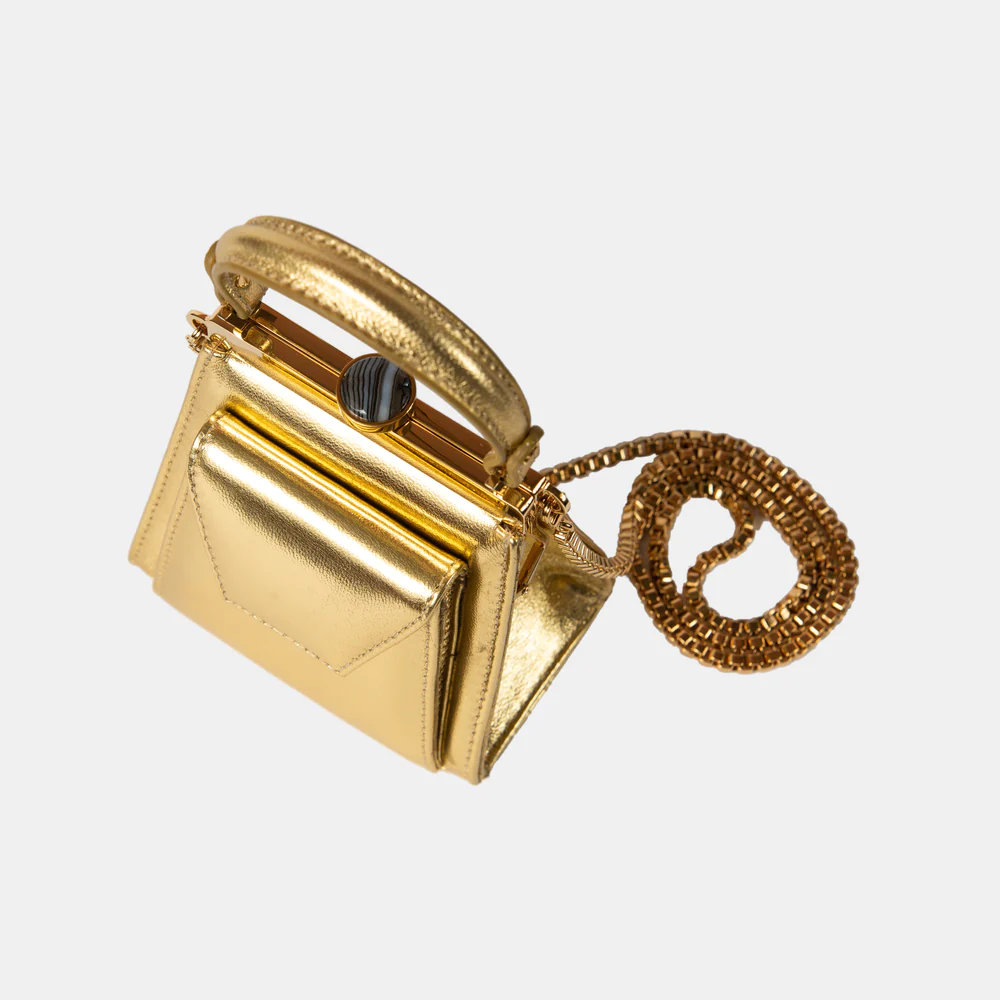 This playful mini bag fuses classic craftsmanship with creative kitsch. Quirky, classy and quintessentially cool.