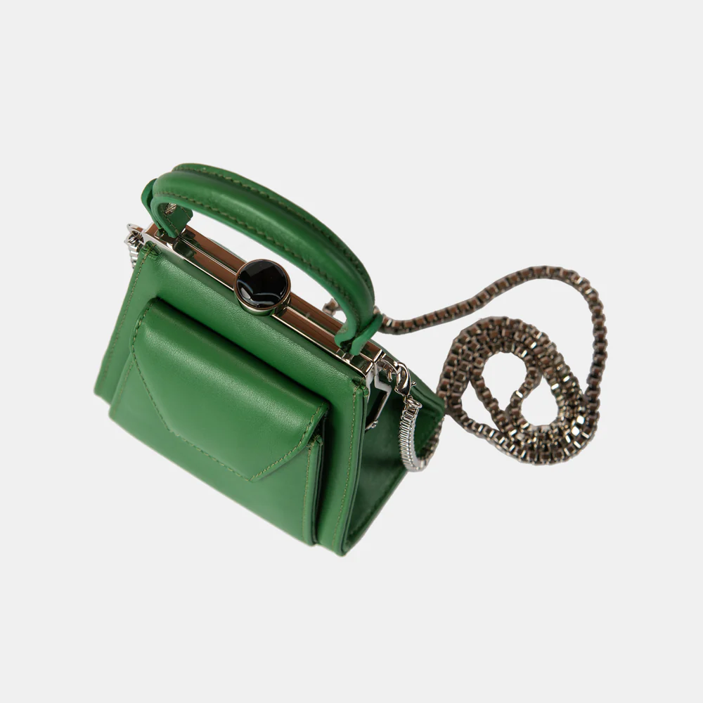 This playful mini bag fuses classic craftsmanship with creative kitsch. Quirky, classy and quintessentially cool.