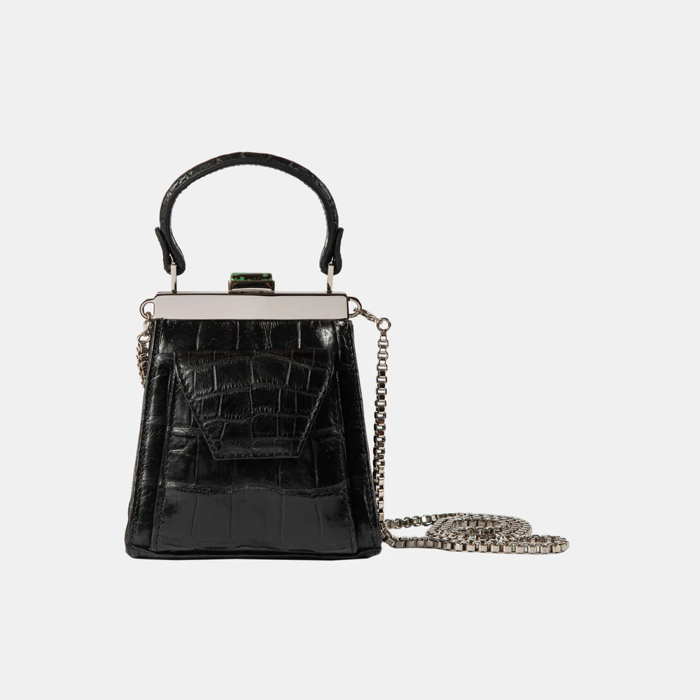 This playful mini bag fuses classic craftsmanship with creative kitsch. Quirky, classy and quintessentially cool.