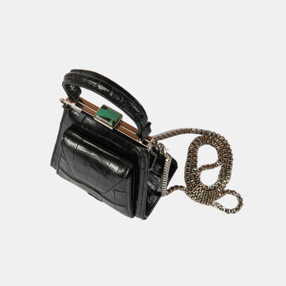 This playful mini bag fuses classic craftsmanship with creative kitsch. Quirky, classy and quintessentially cool.