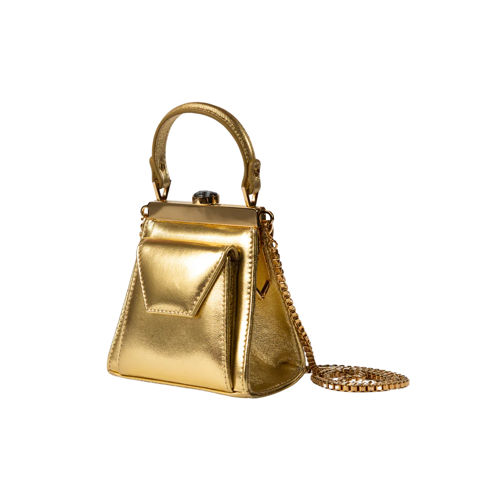 This playful mini bag fuses classic craftsmanship with creative kitsch. Quirky, classy and quintessentially cool.