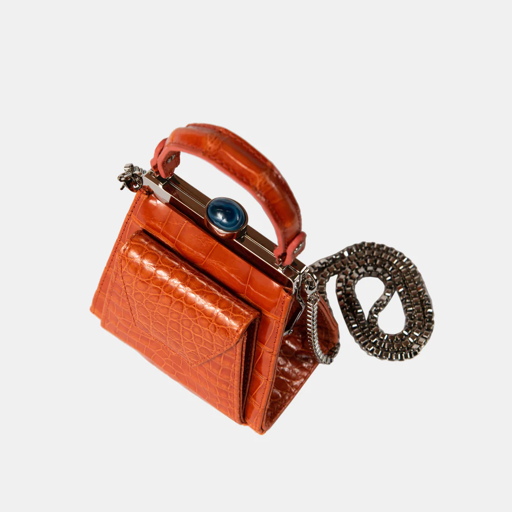 This playful mini bag fuses classic craftsmanship with creative kitsch. Quirky, classy and quintessentially cool.