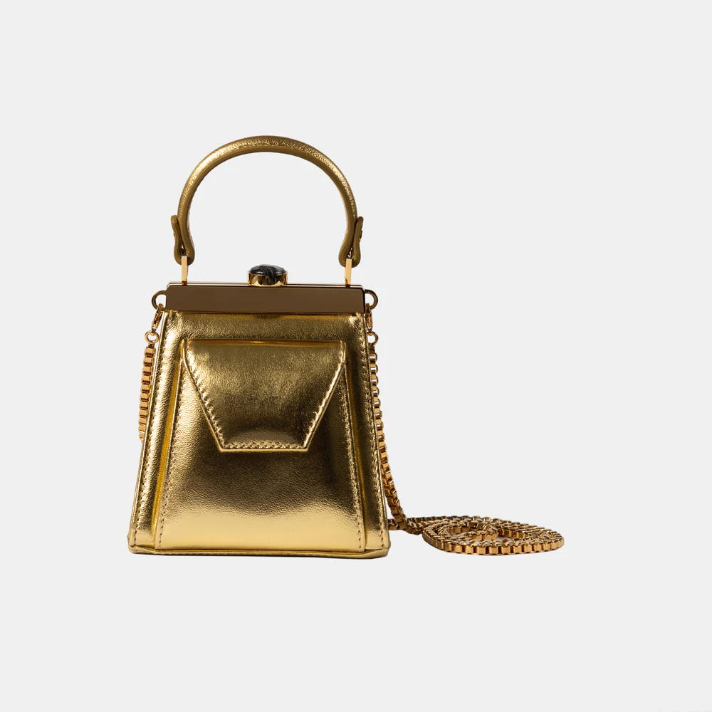 This playful mini bag fuses classic craftsmanship with creative kitsch. Quirky, classy and quintessentially cool.