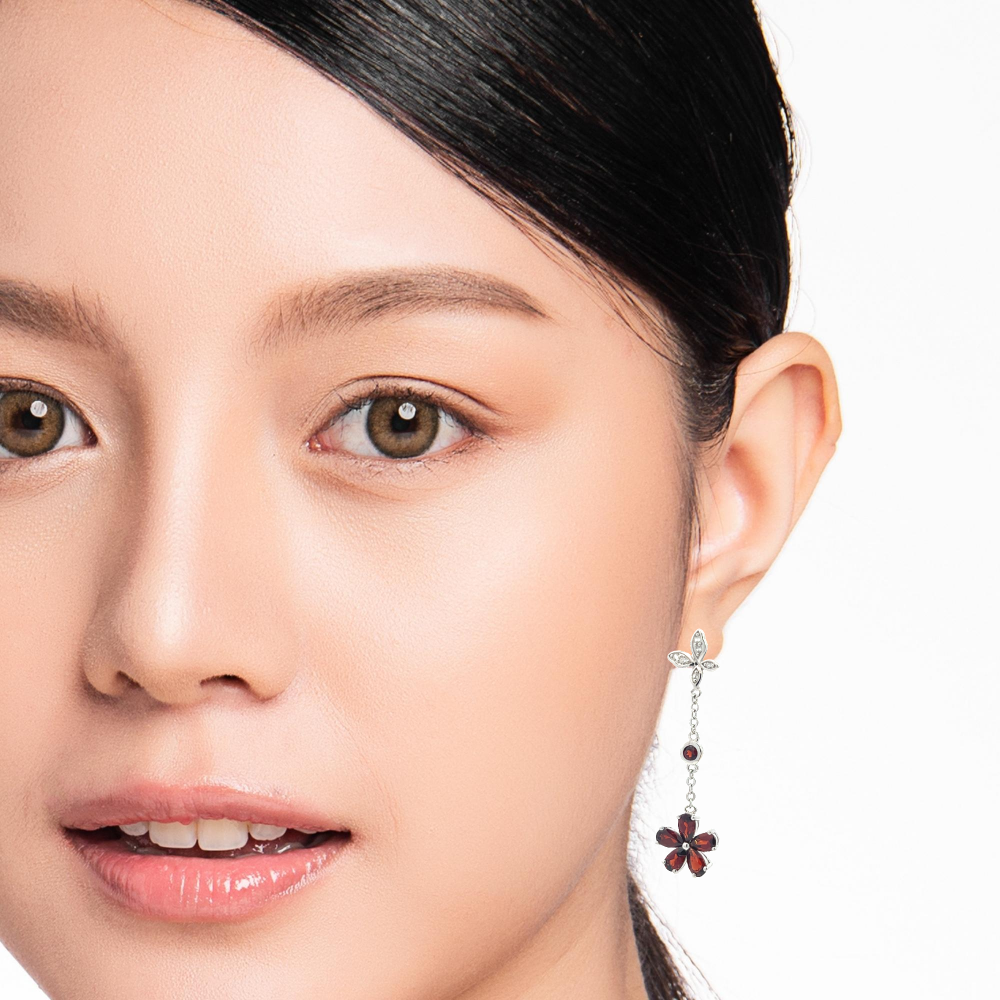 Shop online premium sterling silver garnet dangle earrings with sparkling cubic zirconia stones.
