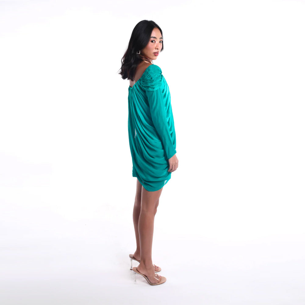 Emerald off shoulder mini dress with pleated bodice and ruched skirt, perfect for parties. Shop online from our curated edit of premium fashion.
