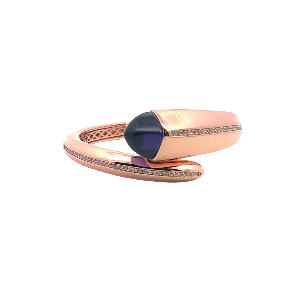 Elegant rose gold plated cuff bracelet with a colored pyramidal crystal and sparkling pavé cubic zirconia accents. Shop premium jewelry online.