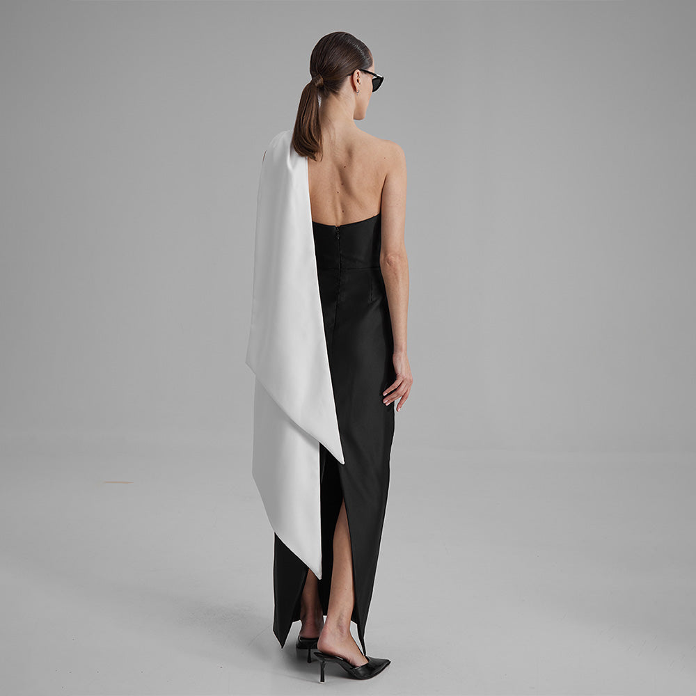 Explore our curation of timeless designer dresses with Gigi black strapless dress with a white cape bow that showcases an elegant silhouette. Shop now!