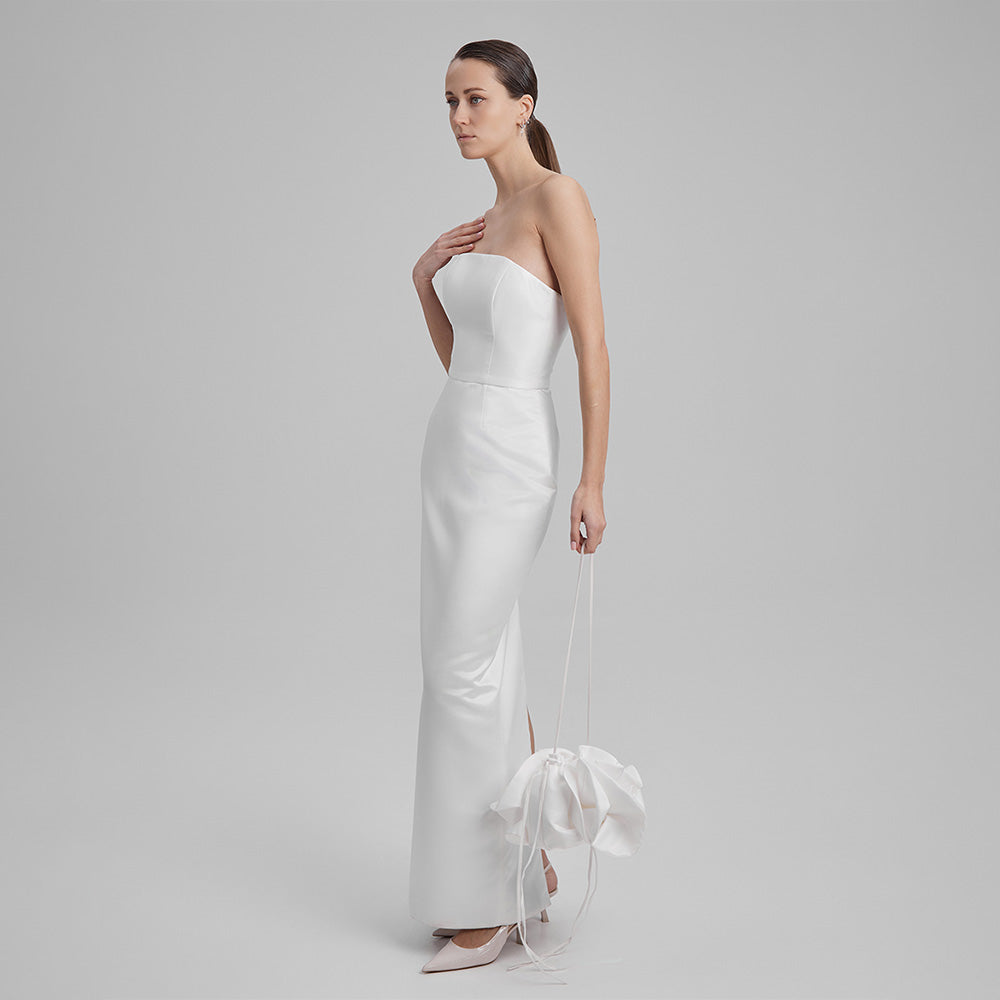 White strapless dress that showcases a refined simplicity that accentuates your natural grace. Explore our curation of designer dresses. Shop now!