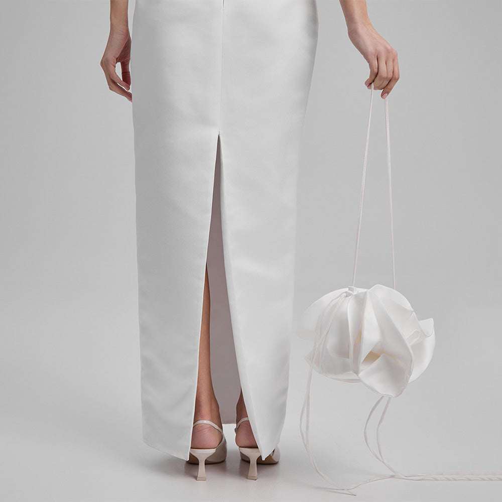 White strapless dress that showcases a refined simplicity that accentuates your natural grace. Explore our curation of designer dresses. Shop now!